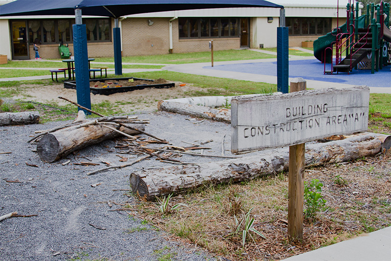 An outdoor space with a sign reading Building Construction Area A