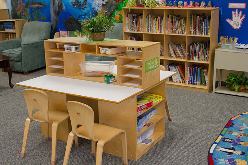 A craft table and reading space in a learning environment