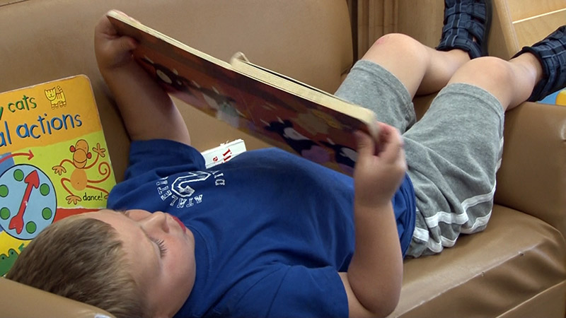 preschoolers reading a book