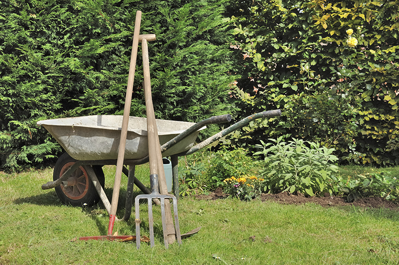 Prop up gardening equipment, like rakes, instead of leaving them lying in the grass.