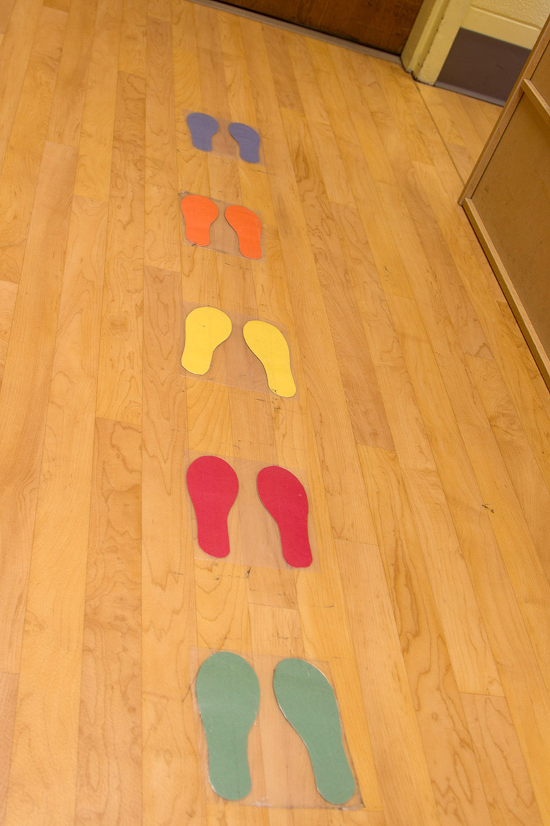 footsteps taped to the floor